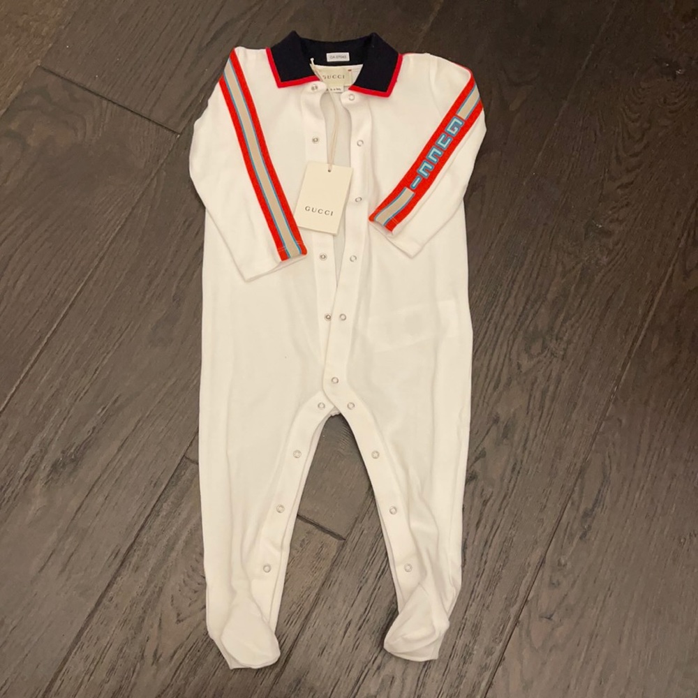 Brand new Gucci 9-12m onesie